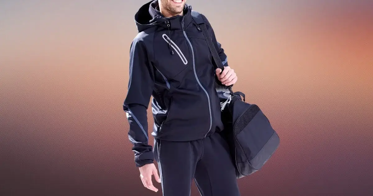 a sports person wearing track suit with a bag.