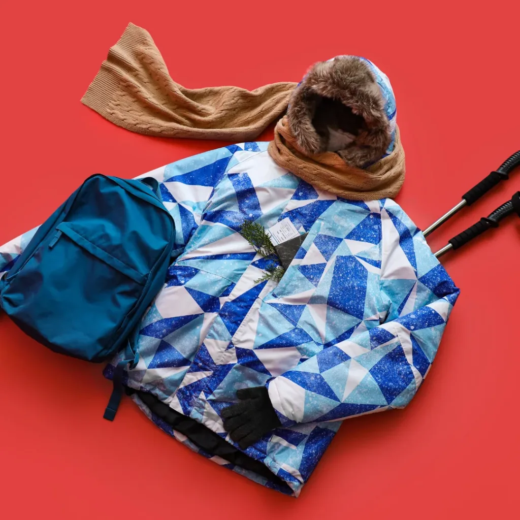 A red background puffer jacket and school bag for kids by Snoopy.